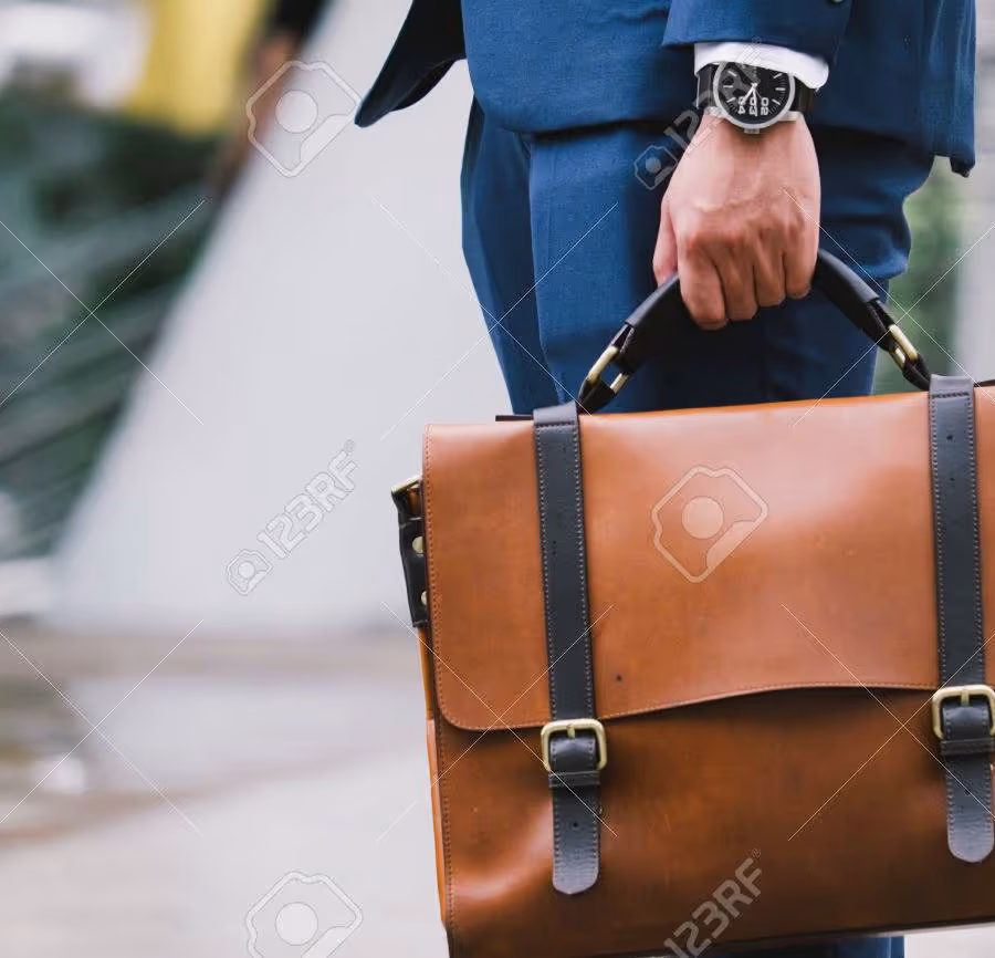 74554547-closeup-of-a-businessman-wear-the-watch-and-holding-leather-briefcase-going-to-work-with-the